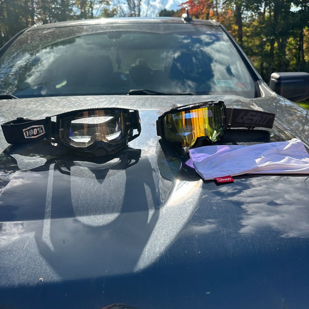 Leatt goggles (tinted) and 100% goggles (clear) both adult size
